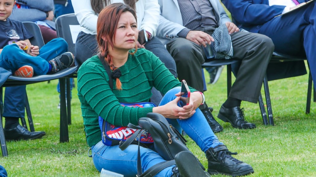 Fotografía de una mujer durante una socialización del Plan de Desarrollo Distrital